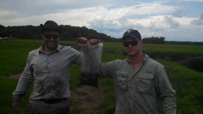 Nate and David proud of their first haul from seining for mummichogs