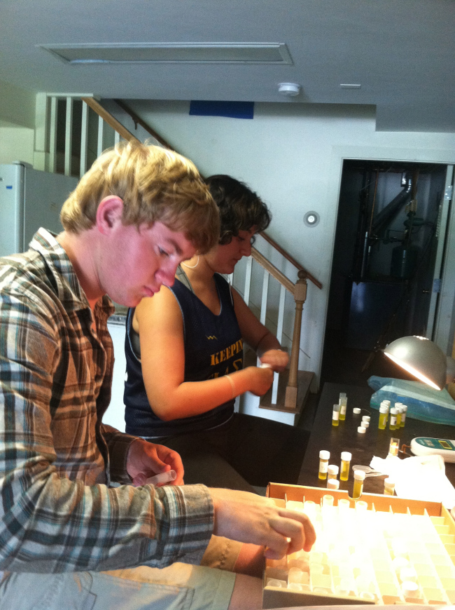 Belle and Marshall taking nitrate levels in water samples from Sweeney salt pans.